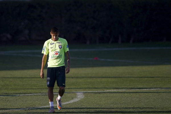 Brazilian soccer team player Neymar walks on the field during a training session in Santiago, Chile