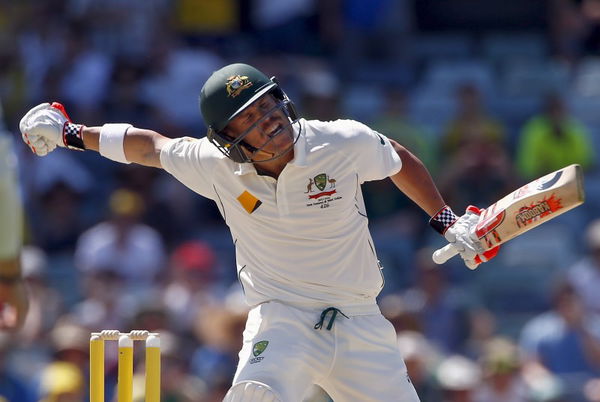 Australia&#8217;s David Warner celebrates reaching his century during the first day of the second cricket test match against New Zealand at the WACA ground in Perth, Western Australia