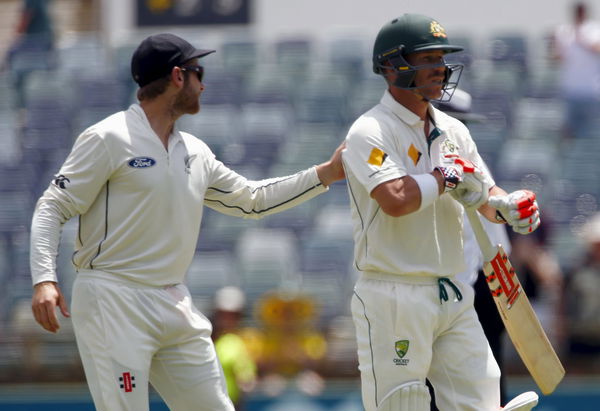 New Zealand&#8217;s Kane Williamson pats Australia&#8217;s David Warner on the back as he walks off the ground after being dismissed for 253 runs during the second day of the second cricket test match at the WACA ground in Perth, Western Australia