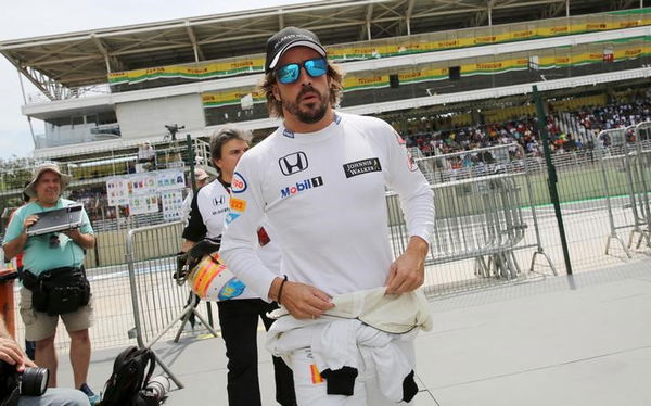 McLaren Formula One driver Alonso of Spain walks after the qualifying session for the Brazilian F1 Grand Prix in Sao Paulo