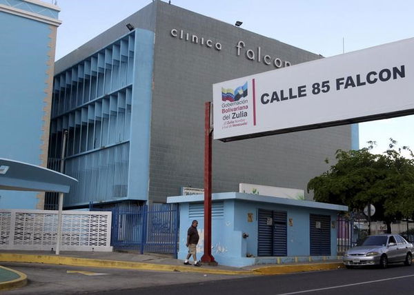 A man walks in front of the Falcon clinic, where Argentine soccer great Diego Maradona, underwent a surgery in Maracaibo