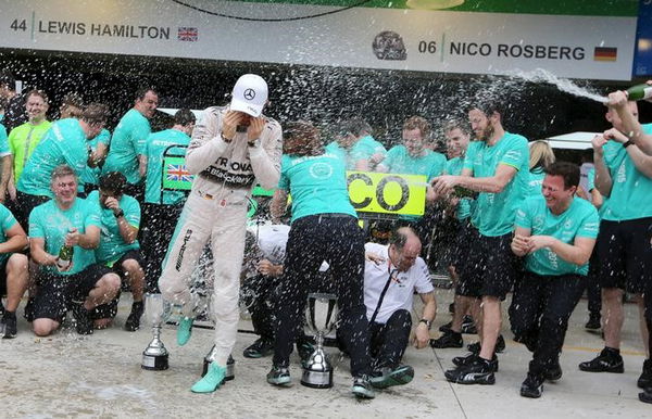 Mercedes Formula One driver Rosberg of Germany celebrates with team mates after winning the Brazilian F1 Grand Prix in Sao Paulo