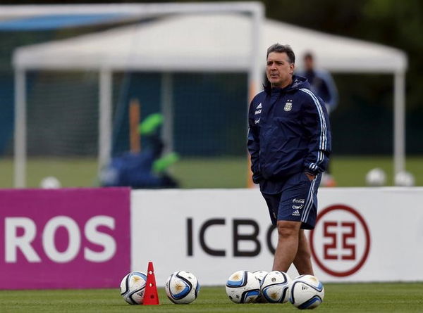 Argentina&#8217;s coach Martino walks during a training session ahead of their 2018 World Cup qualifying soccer match against Brazil in Buenos Aires