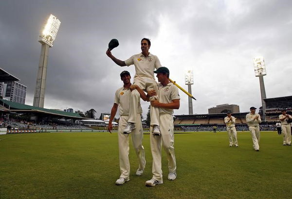 Australia&#8217;s Johnson reacts as he is carried from the field by team mates Starc and Hazlewood at the end the fifth day of the second cricket test match against New Zealand at the WACA ground in Perth