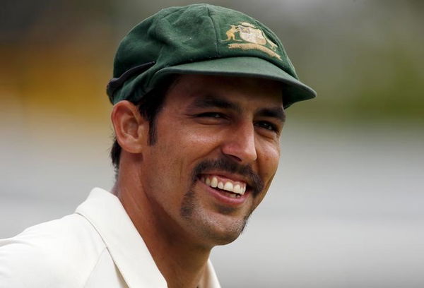 Australia&#8217;s Mitchell Johnson smiles towards a member of the crowd as he fields near the boundary during the fifth day of the second cricket test match against New Zealand at the WACA ground in Perth