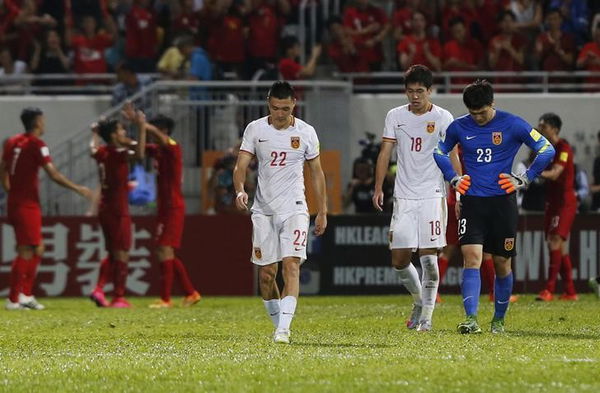 China&#8217;s Yu, Bi and goalkeper Wang leave the pitch as Hong Kong players celebrate after their 2018 World Cup qualifying match, in Hong Kong