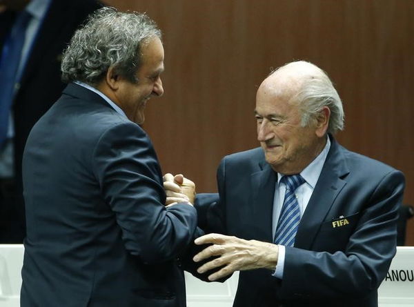 UEFA President Platini congratulates FIFA President Blatter after he was re-elected at the 65th FIFA Congress in Zurich