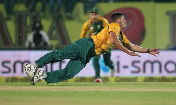 South Africa&#8217;s Lange dives to stop the ball during their first Twenty-20 cricket match against India in Dharamsala