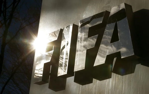 The sun is reflected in FIFA&#8217;s logo in front of FIFA&#8217;s headquarters in Zurich