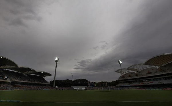 Storm clouds gather above the stadium during the fourth day&#8217;s play in the second Ashes cricket test between England and Australia at the Adelaide Oval