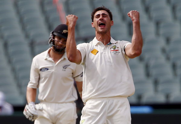 Australia&#8217;s Mitchell Starc (R) celebrates dismissing New Zealand&#8217;s Kane Williamson LBW for 22 runs during the first day of the third cricket test match at the Adelaide Oval, in South Australia