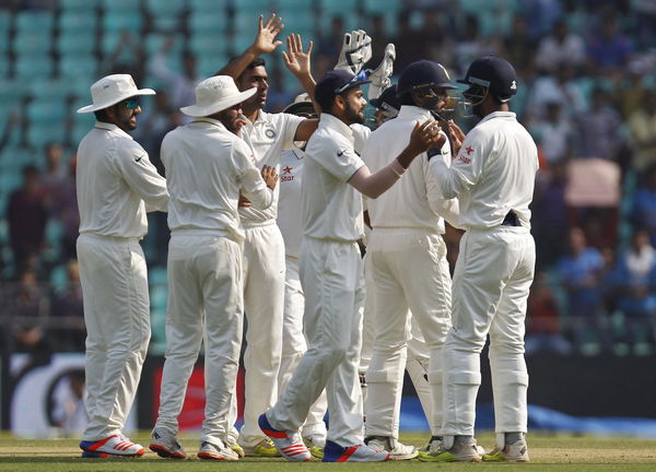 India&#8217;s Ashwin celebrates along with his teammates after taking the wicket of South Africa&#8217;s Elgar during the third day of their third test cricket match in Nagpur