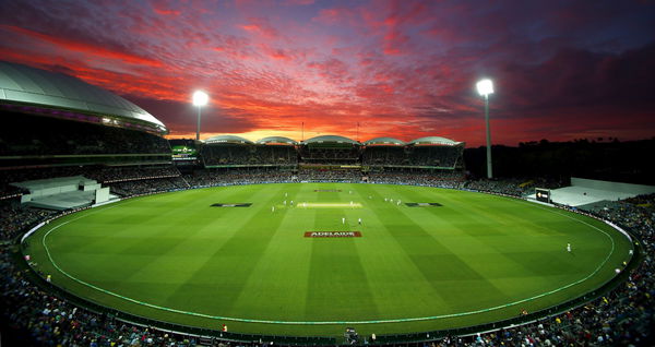 New Zealand&#8217;s Tim Southee bowls as the sun sets during the first day of the third cricket test match against Australia at the Adelaide Oval, in South Australia