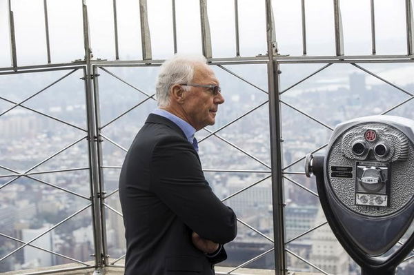 Soccer legend Franz Beckenbauer pauses to look out on the city on top of the Empire State Building during an event to celebrate the start of the New York Cosmos 2015 season, in New York