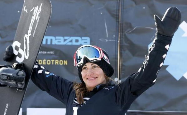 Canada&#8217;s Ricker celebrates on the podium after the women&#8217;s Snowboard-Cross finals at the FIS Snowboard World Championships in Stoneham