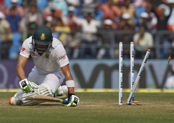 South Africa&#8217;s Faf du Plessis sits after he was bowled out by India&#8217;s Amit Mishra during the third day of their third test cricket match in Nagpur