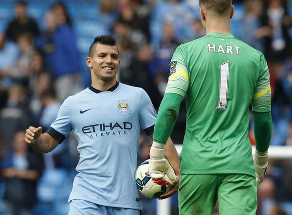 Manchester City&#8217;s Sergio Aguero celebrates with goalkeeper Joe Hart after their English Premier League soccer match against Tottenham Hotspur at the Etihad Stadium in Manchester