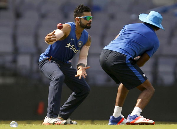 India&#8217;s captain Kohli tries to catch a ball during a practice session ahead of their third test cricket match against South Africa in Nagpur