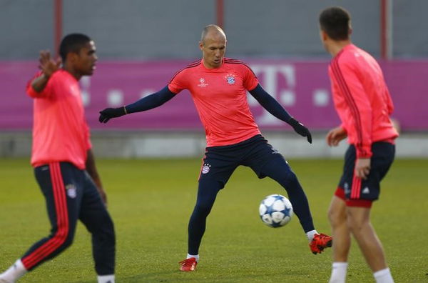 Robben of Bayern Munich warms up during training session before Champions League soccer match against Arsenal in Munich