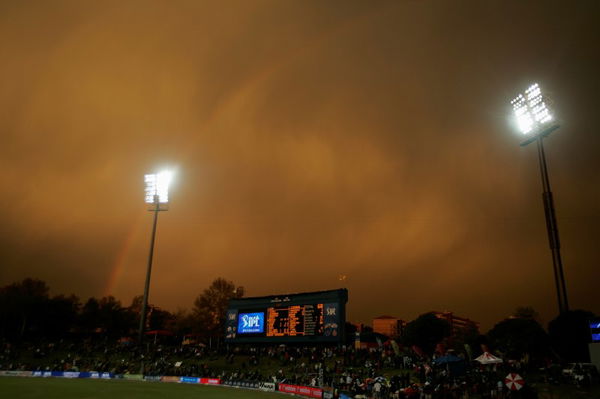 A rainbow appears above the scoreboard as rain disrupts play during the IPL T20 cricket tournament between the Chennai Super Kings and the Kings Punjab in Centurion