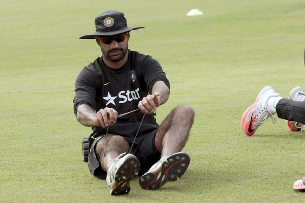 Indian opener Shikhar Dhawan exercises during a practice session in Dhaka