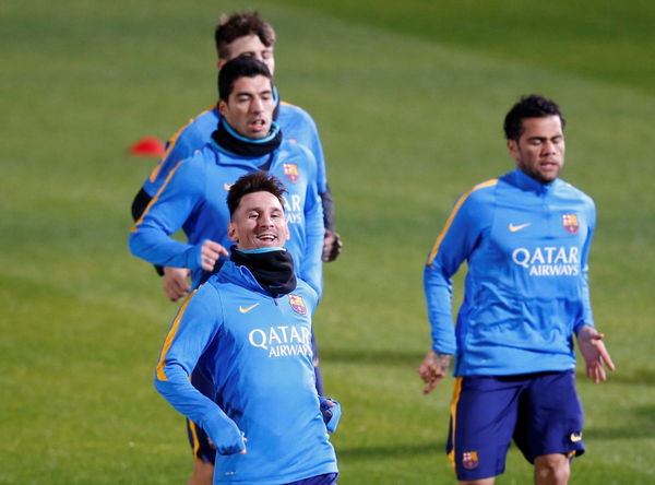 Barcelona&#8217;s soccer players Messi, Suarez, Pique and Alves run during a training session ahead of their Club World Cup semi-final soccer match against Guangzhou Evergrande in Yokohama