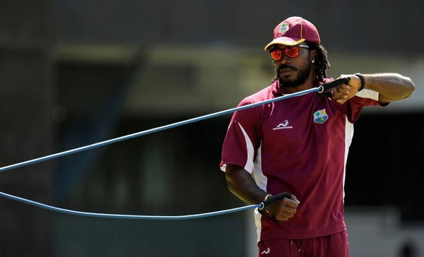 West Indies&#8217; Gayle stretches during a training session in Chennai