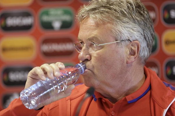 Netherlands&#8217; soccer team coach Hiddink drinks water before a news conference in Riga