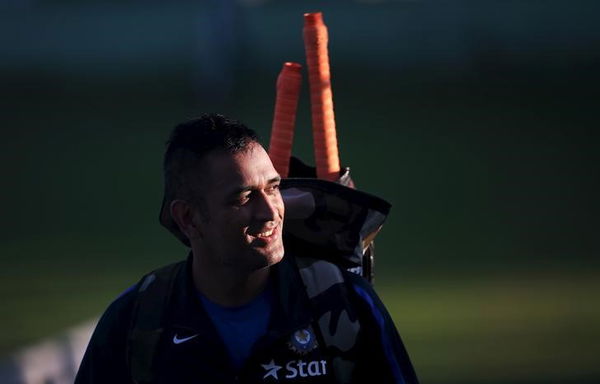 India’s captain Dhoni leaves the nets during a practice session ahead of their first Twenty-20 cricket match against South Africa in Dharamsala