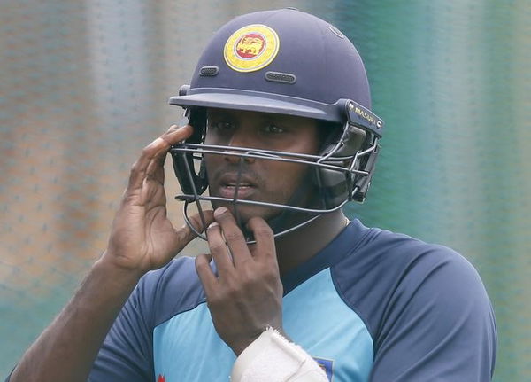 Sri Lanka&#8217;s cricket captain Mathews wears his helmet during a practice session in Galle