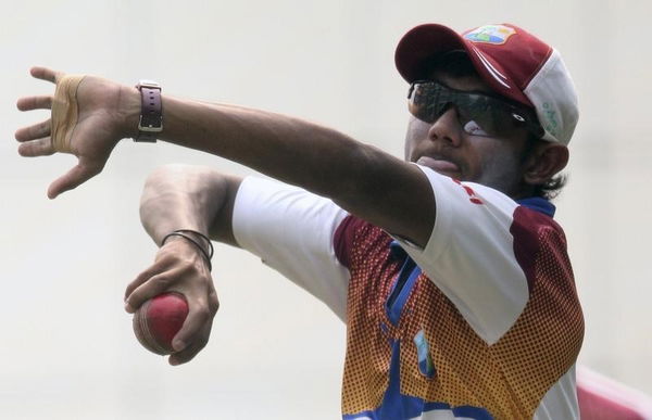 West Indies Devendra Bishoo bowls during a practice session ahead of their first test cricket match against India in New Delhi