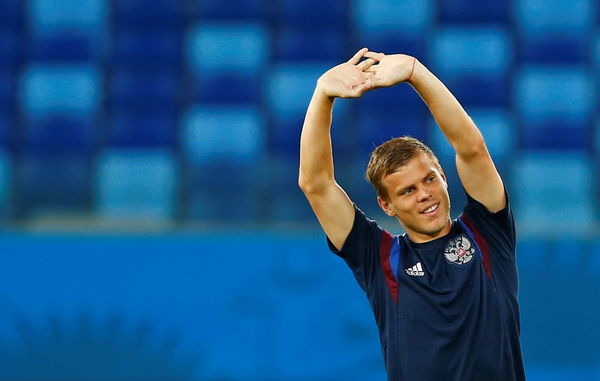 Russia&#8217;s national soccer team player Alexander Kokorin stretches during a training session in the Pantanal arena in Cuiaba