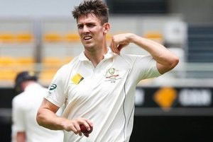 Australian bowler Mitchell Marsh turns at the end of his mark, during the first cricket test match between Australia and New Zealand in Brisbane