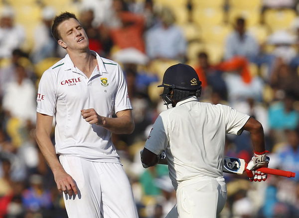 South Africa&#8217;s Morkel reacts as India&#8217;s Mishra runs between wickets during the second day of their third test cricket match in Nagpur