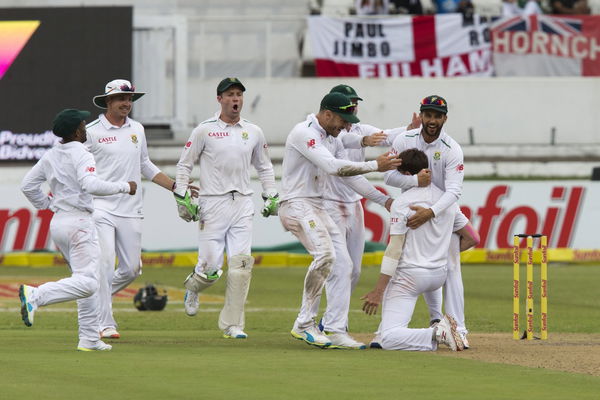 South Africa&#8217;s Steyn celebrates the wicket of England&#8217;s Taylor on his knees with his team mates during the first cricket test match in Durban