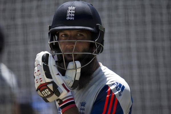 England&#8217;s Ali adjusts his helmet during a training session in Durban