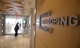 A woman walks into the head offices for WADA in Montreal