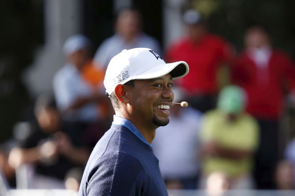 U.S. golfer Woods smiles during a golf clinic in Mexico City