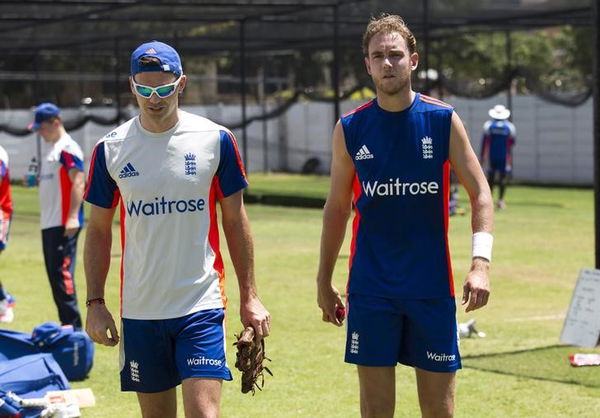 England&#8217;s Anderson who is injured talks with Broad during a training session in Durban