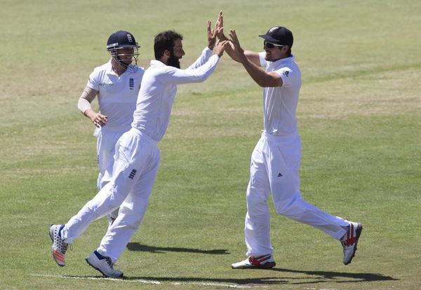 England&#8217;s Taylor, Ali and Cook celebrate the wicket of South Africa&#8217;s AB de Villiers during the first cricket test match in Durban