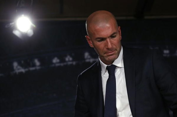 Real Madrid&#8217;s new coach Zinedine Zidane leaves after a news conference at Santiago Bernabeu stadium in Madrid