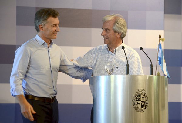 Uruguayan President Vazquez and his Argentine counterpart Macri embrace each other during a joint news conference after their meeting at the Uruguayan Presidential ranch of Anchorena near Colonia City