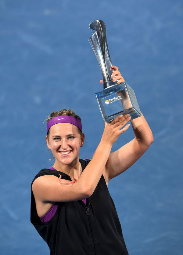 Victoria Azarenka of Belarus celebrates with the winners trophy after defeating Angelique Kerber of Germany in the women&#8217;s singles final at the Brisbane International Tennis Tournament in Brisbane
