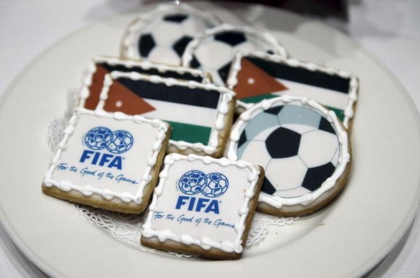 FIFA cookies are seen as Jordanian Prince Ali bin al-Hussein discusses the FIFA corruption scandal in Washington