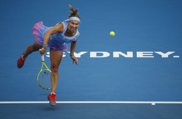 Svetlana Kuznetsova of Russia serves to Simona Halep of Romania during their womens&#8217; singles semi final at the Sydney International tennis tournament in Sydney