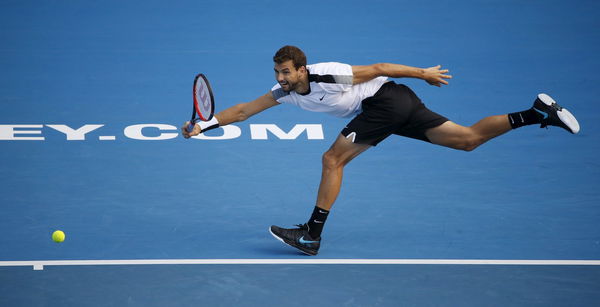 Grigor Dimitrov of Bulgaria hits a return to Gilles Muller of Luxembourg during their mens&#8217; singles semi-finals at the Sydney International tennis tournament in Sydney