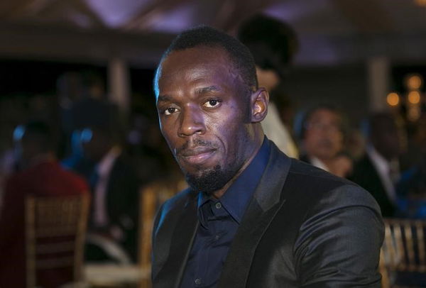 Jamaican sprinter Bolt poses for a photograph while attending the Prime Minister&#8217;s Awards 2015 event in Kingston