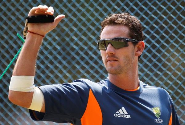 Australia&#8217;s Tait performs a stretching exercise during a cricket practice session in Bangalore