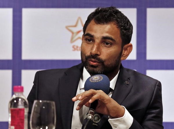 Indian cricketer Shami speaks during a news conference in Mumbai