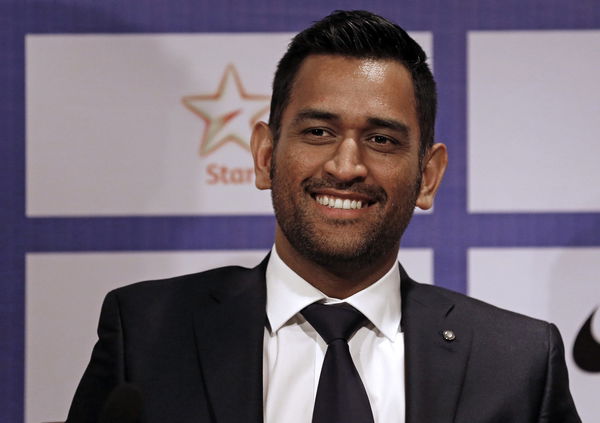 India&#8217;s cricket captain Dhoni smiles during a news conference in Mumbai